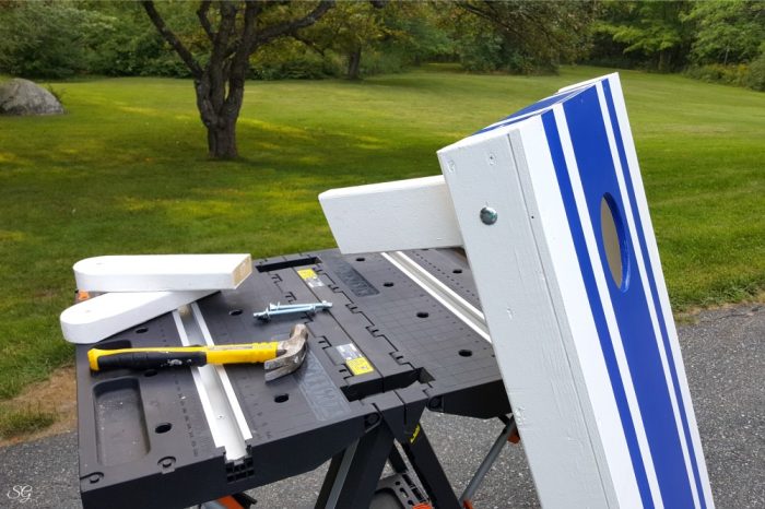 How To Make Cornhole Boards, Blue painted stripes on game set