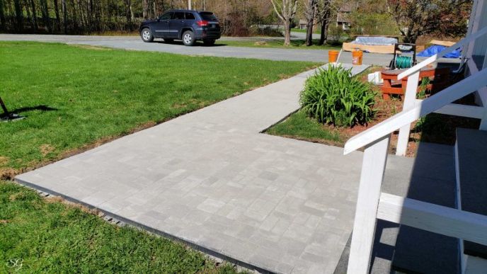 How To Install A DIY Paver Walkway, Installing polymeric sand into walkway pavers