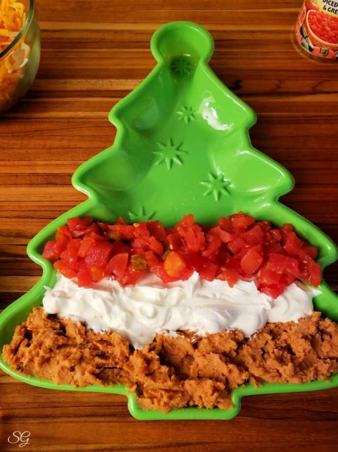5 Layer Bean Dip, A row of ROTEL tomatoes and green chilies for our 5 layer Christmas dip recipe #gatherwithRotel