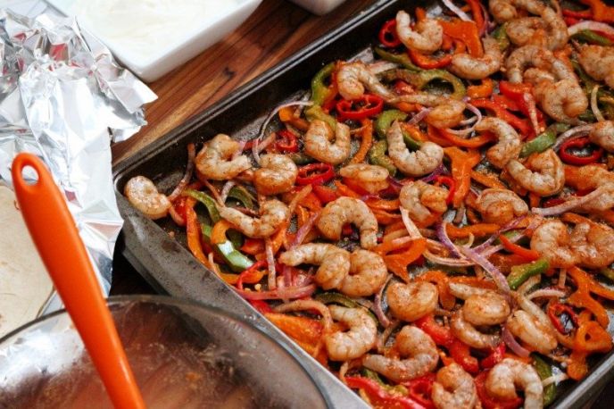 Sheet Pan Shrimp Fajitas Recipe, Making sheet pan shrimp fajitas on one pan with veggies and shrimp