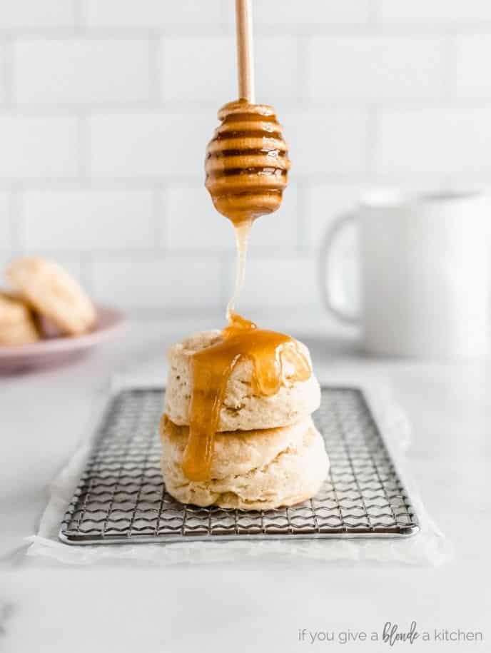 51+ No Yeast Bread Recipes, Homemade buttermilk biscuits, photo of pouring honey over a stack of biscuits