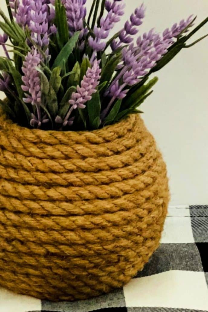 Nautical home decor vase DIY project with rope vase and lavender flowers.